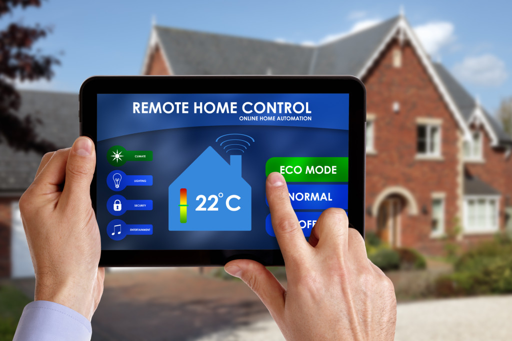 Someone using a tablet to control a smart home